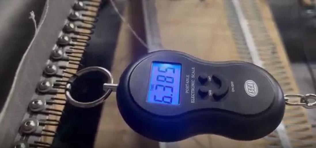 A digital scale used to check a strain gauge reading